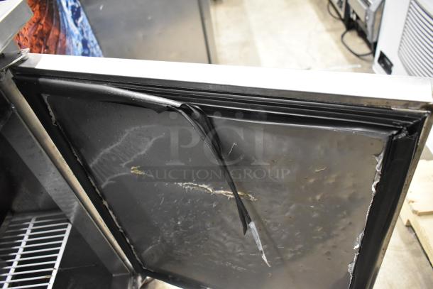 Cooltech CTR-48LBB commercial undercounter cooler with visible wear and torn gasket. Features dual doors and commercial casters. 115V, 1 phase.