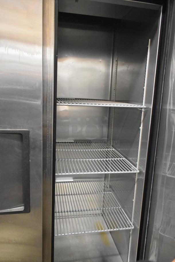 True T-35 Commercial 2 Door Reach-In Cooler, stainless steel, with multiple shelves, 115 volts, 1 phase, excellent condition.