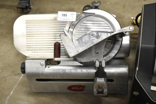 Globe commercial countertop meat slicer with blade sharpener; 115 volts, 1 phase; visible Globe logo; used condition.