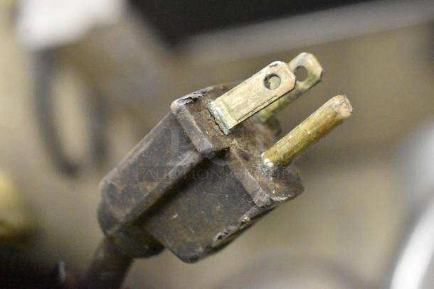 Globe Commercial Meat Slicer plug detail, 115V, 1 phase. Features blade sharpener. Condition shows wear.