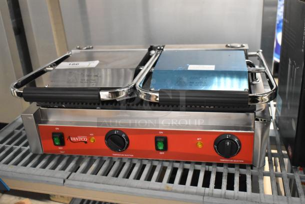 Brand new Avantco 177PG400 dual panini grill with grooved plates, 19 5/8" x 9 1/8" surface, 120V, 1 phase, slight scratches.