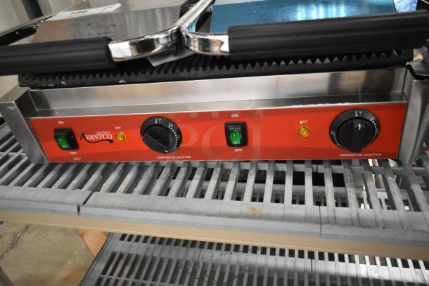 Brand new Avantco 177PG400 dual panini grill, grooved plates, 19 5/8"x9 1/8" surface, 120V, minor scratches.