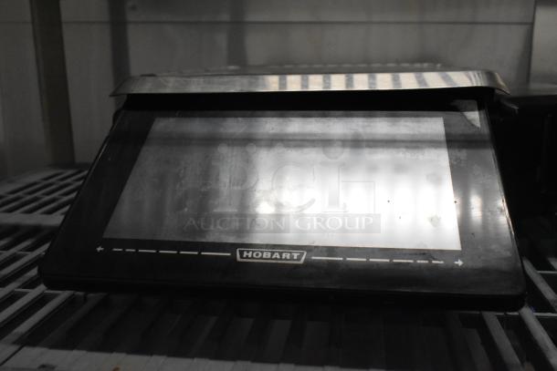 2016 Hobart HTi-LH commercial countertop scale, missing power cord, black, Hobart logo visible. Model for 120/208-240 volts.