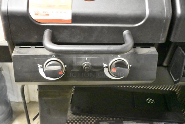 Char-Griller Professional Propane Gas Grill, features dual control knobs, sturdy black finish, visible label indicates grill area.