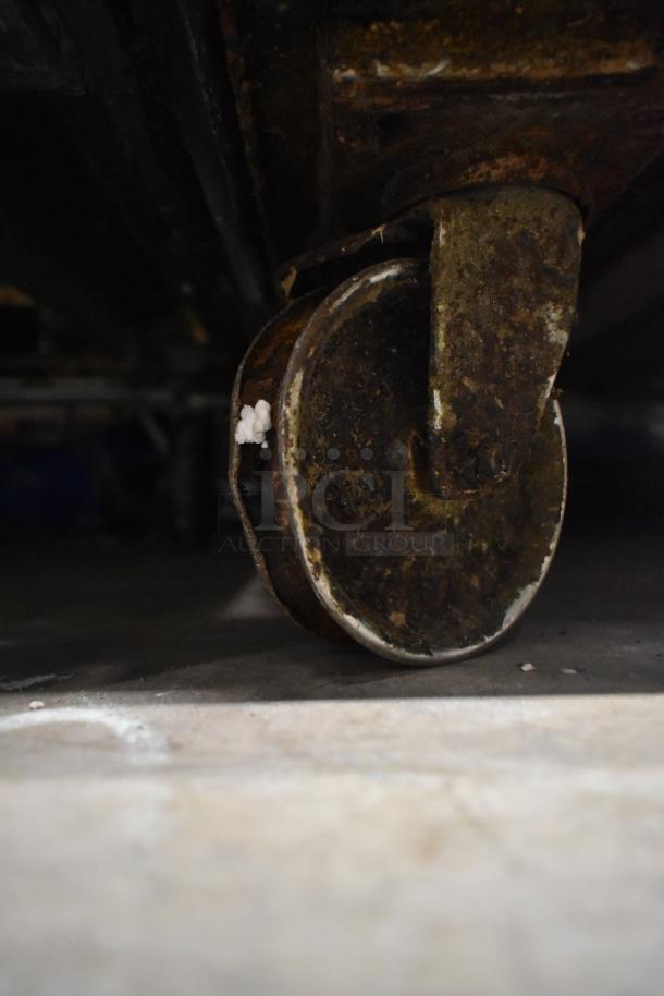 Rusted caster on an Alto Shaam 1000-TH oven. Caster condition shows significant wear.