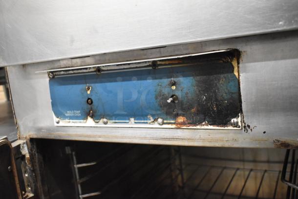 Alto Shaam 1000-TH oven with visible wear, damaged control panel, and functional lower compartment. Top door inoperative.