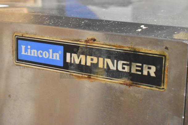 Lincoln Impinger 1302 Conveyor Pizza Oven, 240V, 1 Phase, commercial countertop model, some visible wear and rust.
