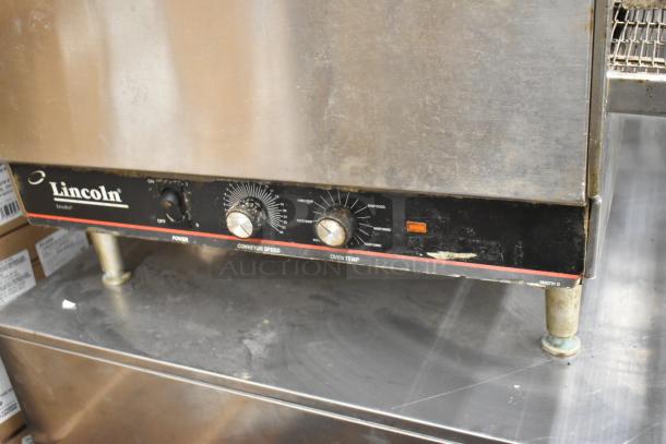Lincoln Impinger 1302 countertop conveyor pizza oven, electric, 240V, 1 phase, control panel with power, speed, temp dials.