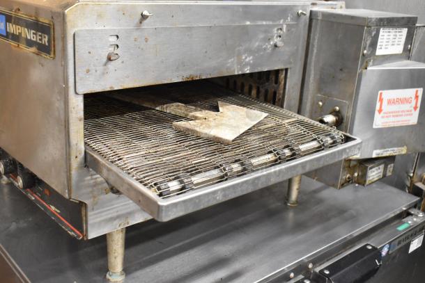 Lincoln Impinger 1302 commercial electric conveyor pizza oven, 240V, 1 phase. Shows wear, with visible labels and controls.