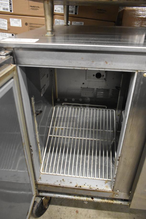 Beverage Air UCR36A undercounter cooler, two doors, on commercial casters. Visible wear, 115V, 1 phase. Suitable for commercial use.