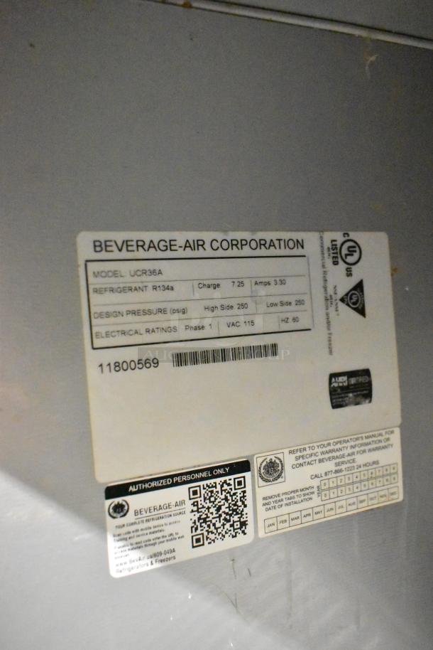 Beverage Air UCR36A undercounter cooler, 2-door, on casters, 115V, 1-phase. Label shows model, refrigerant, and electrical ratings.