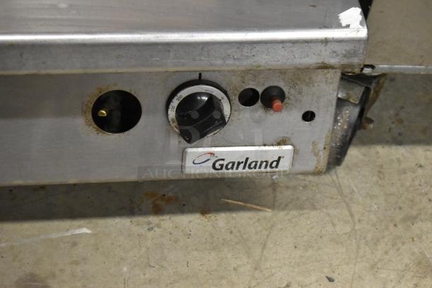 Garland Commercial Gas Countertop Ribbed Griddle, stainless steel, temperature knob, slight wear, branded logo visible.