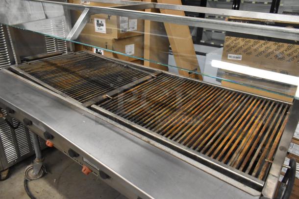 MagiCater LPAGA60 commercial propane charbroiler grill with visible wear, on commercial casters for portability.
