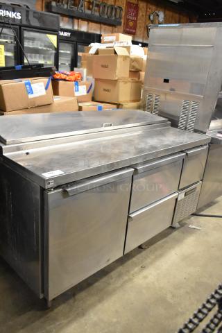 Continental CPA60 pizza prep table with 2 drawers and 2 doors, on commercial casters. Stainless steel, 115V, 1 Phase. Slight wear visible.