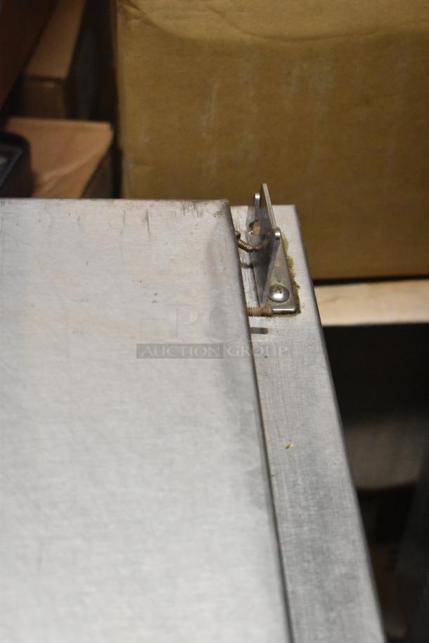 Continental CPA60 pizza prep table corner detail shows metal finish and construction quality. Includes 2 drawers and doors.