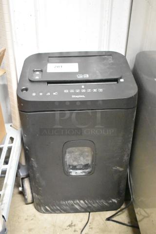 Staples ST62157 micro-cut shredder, 120 volts, 1 phase, black exterior, visible power cord, slight surface wear.