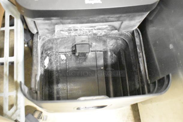 Staples ST62157 Micro-Cut Shredder, 120V, 1 Phase, showing interior condition with visible wear.