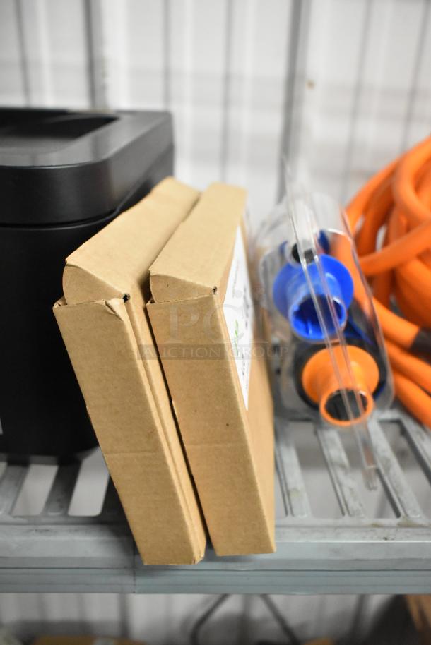 3 items including 2 HT03XL-BTI Li Polymer batteries in boxes and a Fargo DTC color ribbon, arranged on a shelf.