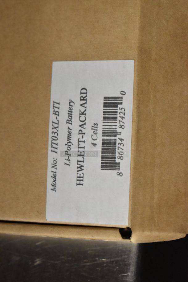 Box with label showing HT03XL-BTI Li-Polymer Battery for Hewlett-Packard, 4 cells. Auction includes three items.