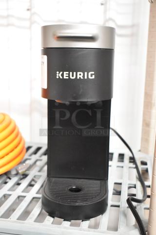 Keurig K900 countertop single cup coffee machine, black, 120 volts, 1 phase, with Keurig logo, in good condition.