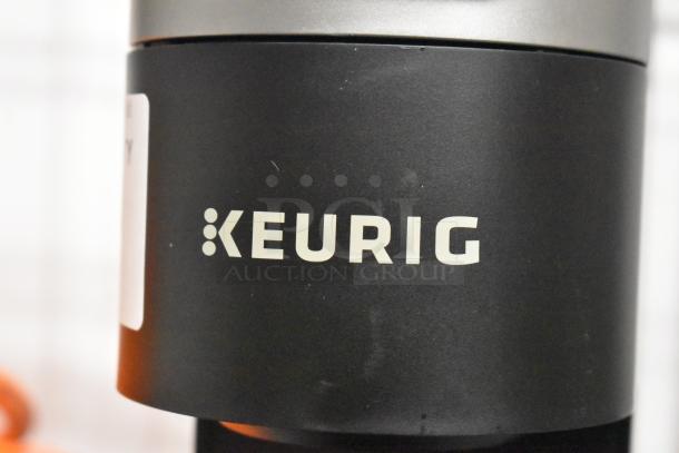 Keurig K900 countertop coffee machine, black, single cup, 120 volts, branded logo visible, excellent condition.
