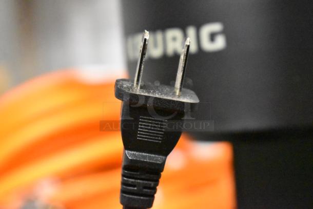 Keurig K900 coffee machine with visible power cord. Features single cup serving, 120 volts, 1 phase. Brand logo visible.