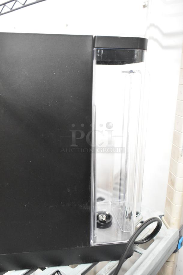 Keurig K900 countertop single cup coffee machine, black finish, model K900, 120 volts, 1 phase, excellent condition.