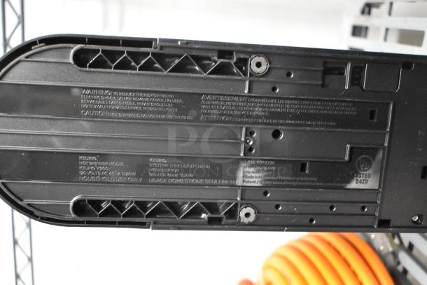 Keurig K900 coffee machine base showing model label, 120V, 1 phase, household use.