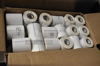 Two boxes of receipt printer rolls, includes multiple rolls with visible labels indicating dimensions and specifications.