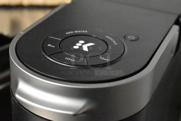 IN ORIGINAL BOX! Keurig K Slim coffee machine, single cup, 120 volts, 1 phase. Features brew size buttons: 8oz, 10oz, 12oz.