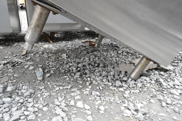 Perlick commercial counter with door, stainless steel, showing adjustable legs, minor wear visible. Ideal for high-traffic use.