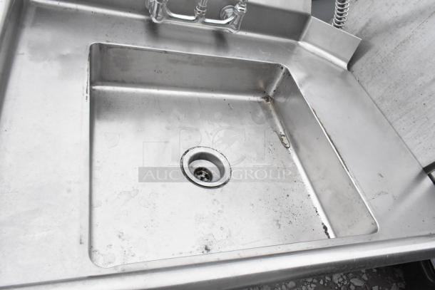 Commercial left side dirty side dishwasher table, stainless steel, visible grime, industrial faucet, used condition.