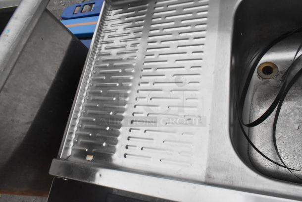 Krowne 3 bay back bar sink with dual drain boards, integrated faucet, and speedwell. Stainless steel, good condition.