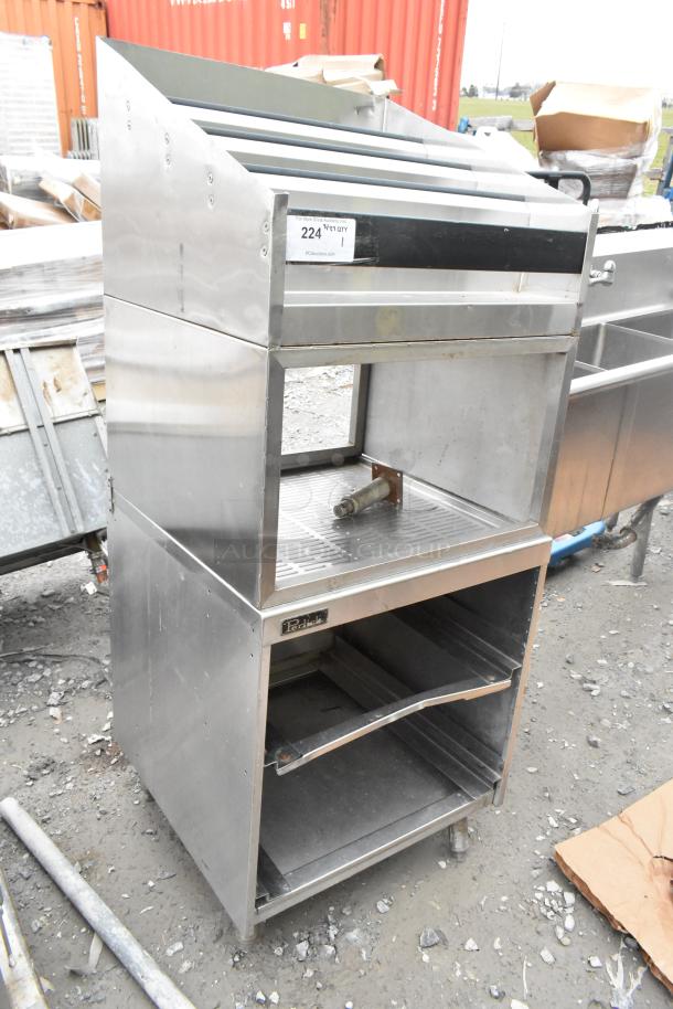 Perlick bottle display on drain board, stainless steel, used condition, visible Perlick branding, auction tag present.