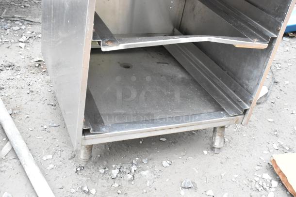 Perlick Bottle Display with Drain Board, stainless steel, two-tiered shelves, used condition, sturdy legs. Ideal for bars.