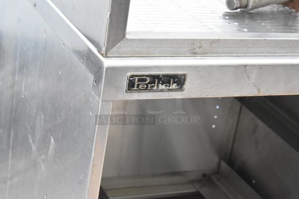 Perlick stainless steel bottle display with drain board, visible brand label, used condition.