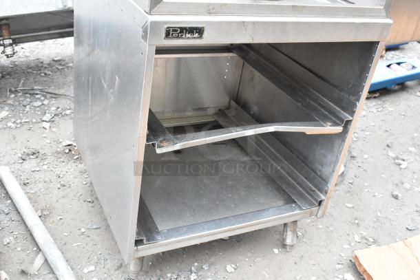 Perlick bottle display on drain board, stainless steel, with open shelving. Brand label visible. Used condition.