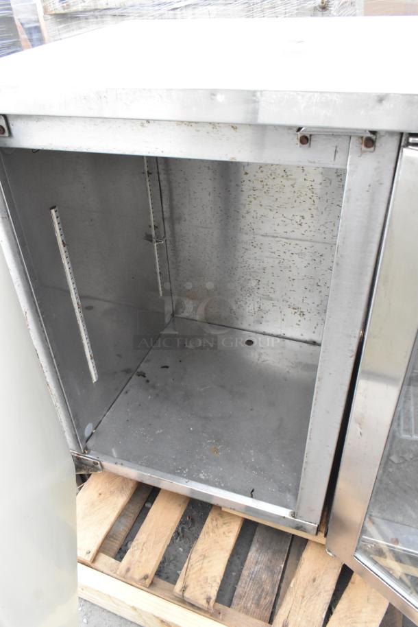 Perlick BS3DS commercial 4-door back bar cooler, stainless steel interior, visible wear, 115 volts, 1 phase.