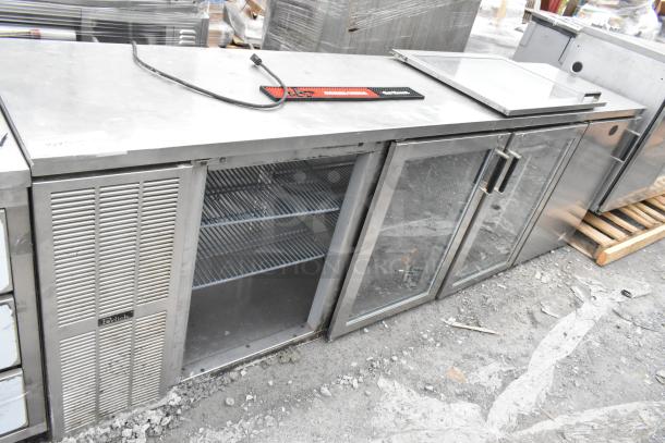 Perlick BS3DS Commercial Back Bar Cooler, 4 doors with 3 merchandiser doors visible, one door detached, runs on 115 volts, 1 phase.