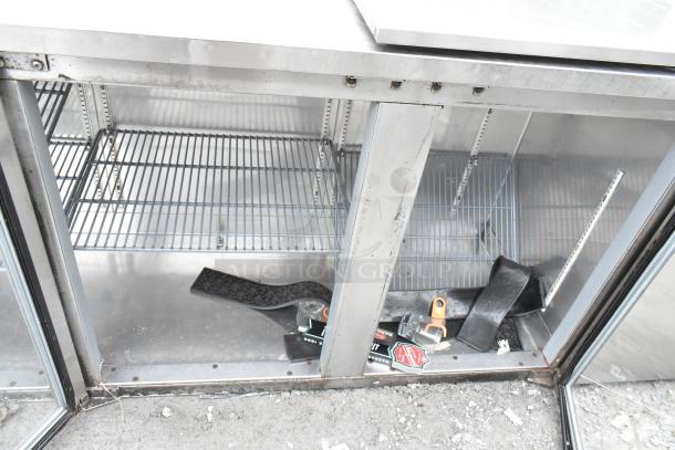 Perlick BS3DS commercial cooler, 4-door, 115 volts, 1 door detached, shelves visible, mild wear.