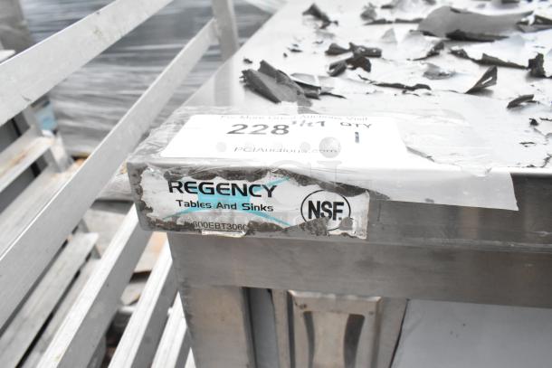 Regency 600EBT3060 table with enclosed base, sliding doors, drawers; NSF label visible, stainless steel, used condition.