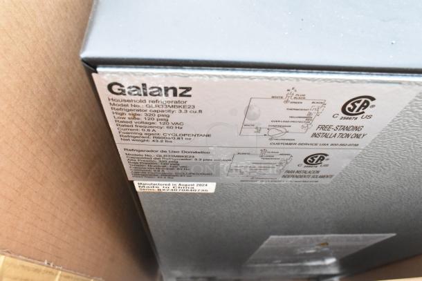 3 mini coolers, including Galanz GLR33MBKE23. 3.3 cu ft capacity, 120 volts, 1 phase. Visible label with specs and model details.