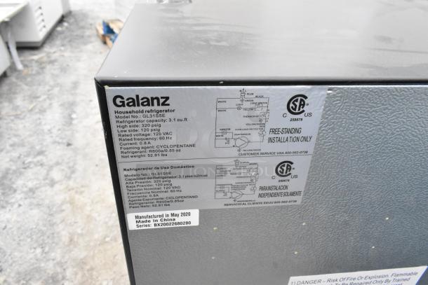 Galanz mini coolers with labels showing model GL3155E, capacity 3.1 cu ft, 120V, 1 Phase. Tags indicate May 2020 manufacture.
