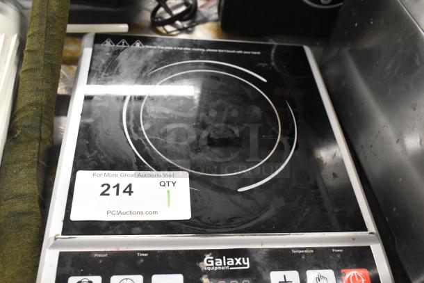 Galaxy 177GICP18 countertop induction range, single burner, 120V, 1 phase. Shows wear. Auction label: 214, QTY 1.