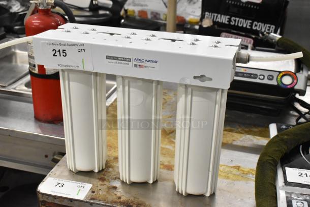 Apec Water WFS-1000 water filtration system with three cylindrical filters, model number on label, in good condition.