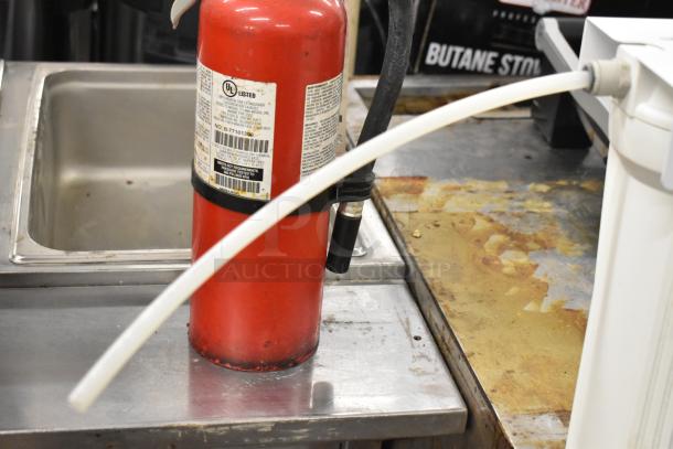 Apec Water WFS-1000 Water Filtration System, shown connected on a countertop in used condition.