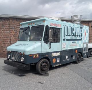 2002 Freightliner MT45 food truck, Ludicrous wrap, 18', propane hookup, grease hood, fryer, griddle, grill, refrigeration, serving window.