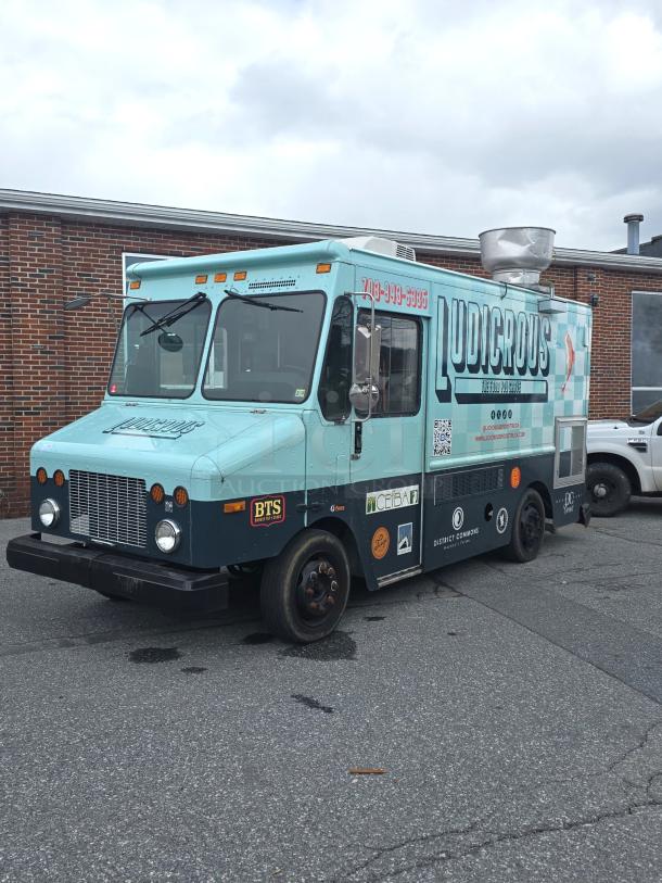 2002 Freightliner MT45 Ludicrous 18' food truck, propane hookup, grease hood, fryer, griddle, grill, refrigeration, serving window.