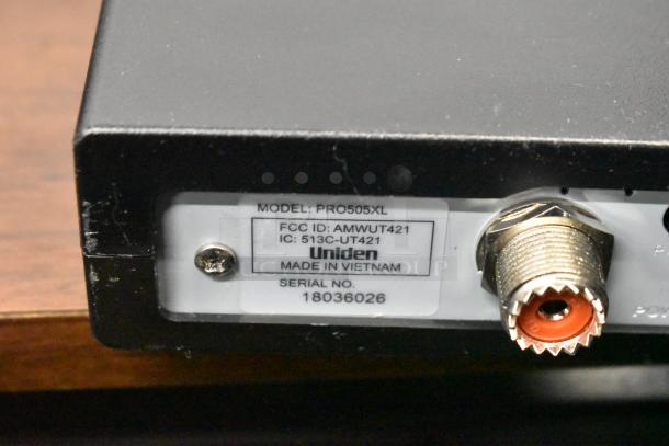 Uniden Pro505XL radio with visible model and serial labels, made in Vietnam. Part of a 62-item auction lot.