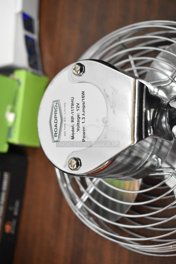 RoadPro metal fan, Model RP-1179HU, 12V, 16W. Featured among 25 assorted items in auction bundle.